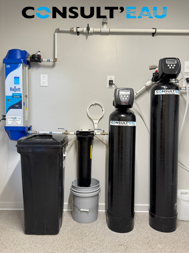 Photo montrant l’installation d’un système de traitement d’eau complet incluant un système de désinfection par ultraviolet (UV) Hallett, garantissant une eau sécuritaire et purifiée. Si tu veux, je peux aussi te proposer un titre et un résumé SEO pour cet article.